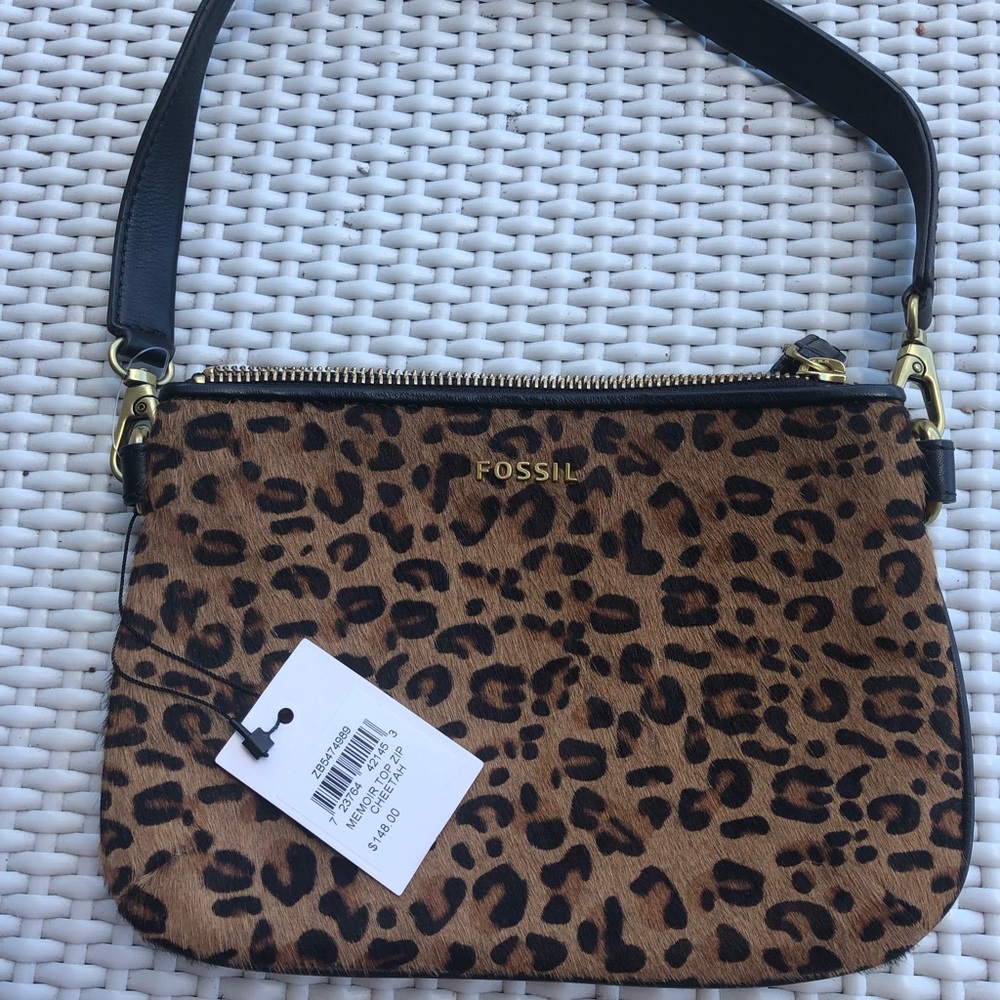 Cute Leopard clutch with detachable straps.